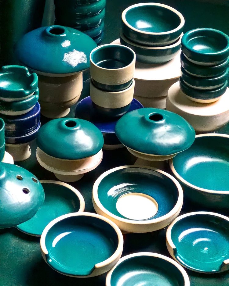 Stoneware bowls and incense burners in deep teal glazes